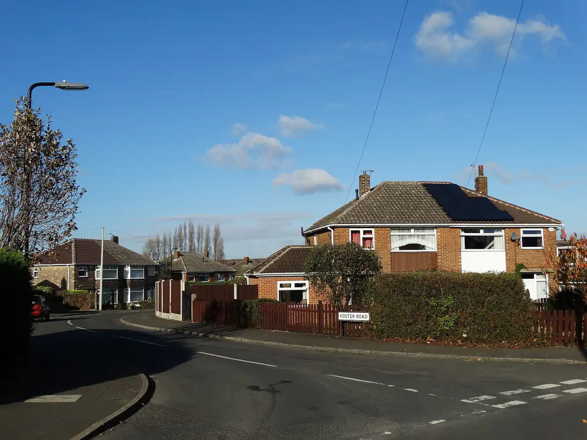 A semi-detached house on Foster Road in Wickersley under a blue sky